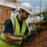 A builder laying brickwork on site
