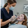 A dentist treating a patient in the chair