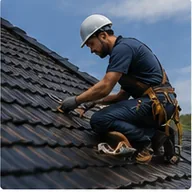 A roofer working on a tiled roof